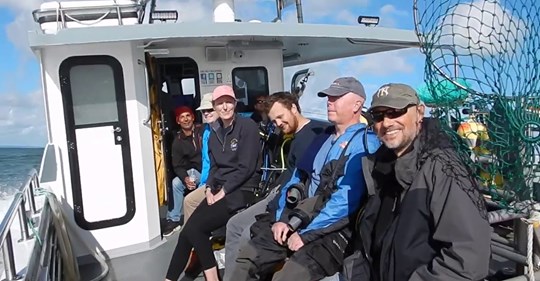 Divers on a boat off for a dive